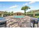 Community pool with plenty of lounge chairs at 3390 Cedar Spring Pl # 163, Winter Park, FL 32792