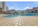Relaxing freeform swimming pool with surrounding patio at 5300 S Atlantic Ave # 2-502, New Smyrna Beach, FL 32169