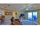 Living area featuring comfortable seating, access to balcony, and ocean view at 5300 S Atlantic Ave # 2-502, New Smyrna Beach, FL 32169