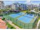 Two well-maintained tennis courts with surrounding fence at 5300 S Atlantic Ave # 2-502, New Smyrna Beach, FL 32169