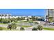 Aerial view of beachfront property with ocean view, tropical landscaping, and recreational amenities at 5300 S Atlantic Ave # 2-502, New Smyrna Beach, FL 32169