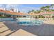 Relaxing community pool with patio and lounge chairs at 5300 S Atlantic Ave # 2-502, New Smyrna Beach, FL 32169