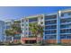 Three-story building with balconies and parking in front at 5300 S Atlantic Ave # 2-502, New Smyrna Beach, FL 32169