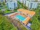 Complex pool, hot tub, and clubhouse from above at 5300 S Atlantic Ave # 2-502, New Smyrna Beach, FL 32169