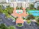 Community clubhouse with pool, tennis courts, and ample parking at 5300 S Atlantic Ave # 2-502, New Smyrna Beach, FL 32169