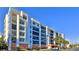 Modern condo building with blue accents and parking at 5300 S Atlantic Ave # 2-502, New Smyrna Beach, FL 32169