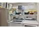Laundry room with washer, dryer, and storage shelves at 5300 S Atlantic Ave # 2-502, New Smyrna Beach, FL 32169