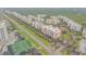 Aerial view showing condo community, tennis courts, and oceanfront location at 5300 S Atlantic Ave # 2-502, New Smyrna Beach, FL 32169