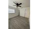 Bright bedroom with ceiling fan and vinyl plank flooring at 603 Maggie Cir, Winter Haven, FL 33880