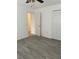 Spacious bedroom with new flooring and access to a bathroom at 603 Maggie Cir, Winter Haven, FL 33880