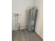 Laundry room features a water heater and space for a washer and dryer at 603 Maggie Cir, Winter Haven, FL 33880