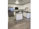 Modern kitchen with stainless steel appliances and island at 603 Maggie Cir, Winter Haven, FL 33880