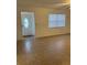 Bright living room with tile flooring and view of entryway at 603 Maggie Cir, Winter Haven, FL 33880