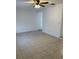 Bright living room featuring tile floors and a ceiling fan at 603 Maggie Cir, Winter Haven, FL 33880