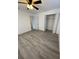 Spacious bedroom with ceiling fan and double door closet at 603 Maggie Cir, Winter Haven, FL 33880