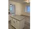 Renovated kitchen featuring granite countertops and white shaker cabinets at 603 Maggie Cir, Winter Haven, FL 33880