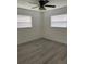 Spacious bedroom with ceiling fan and vinyl plank flooring at 603 Maggie Cir, Winter Haven, FL 33880