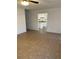 Spacious living room with tile floors and kitchen access at 603 Maggie Cir, Winter Haven, FL 33880