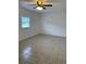 Spacious living room with tile floors and a ceiling fan at 603 Maggie Cir, Winter Haven, FL 33880