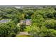Two-story house nestled in a wooded neighborhood at 8407 River Branch Pl, Sanford, FL 32771