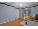 Bright home office features wood floors and a built-in desk at 8407 River Branch Pl, Sanford, FL 32771