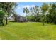 Spacious backyard with lush lawn and view of home at 8407 River Branch Pl, Sanford, FL 32771