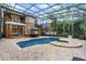 Large pool and spa with a screened enclosure and patio furniture at 8407 River Branch Pl, Sanford, FL 32771