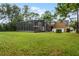 Large backyard with a view of the house and pool area at 8407 River Branch Pl, Sanford, FL 32771