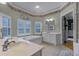 Elegant Primary bathroom featuring a garden tub and double sinks at 8407 River Branch Pl, Sanford, FL 32771