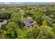 House with pool and screened enclosure, surrounded by trees at 8407 River Branch Pl, Sanford, FL 32771