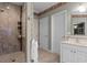Modern bathroom with a walk-in shower and single vanity at 8407 River Branch Pl, Sanford, FL 32771