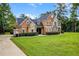 Two-story house with stone accents and a large front yard at 8407 River Branch Pl, Sanford, FL 32771
