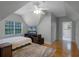 Comfortable bedroom with hardwood floors and ensuite bathroom at 8407 River Branch Pl, Sanford, FL 32771