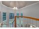 Elegant staircase with a chandelier and multiple windows, offering natural light at 8407 River Branch Pl, Sanford, FL 32771