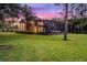 Two-story house with screened enclosure and yard at 8407 River Branch Pl, Sanford, FL 32771