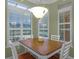 Well lit breakfast nook with white table and built-in hutch at 8407 River Branch Pl, Sanford, FL 32771