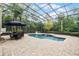 Inviting pool area with a screened enclosure and patio furniture at 8407 River Branch Pl, Sanford, FL 32771