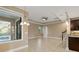 Spacious dining area with tile flooring, ceiling fan, and access to the backyard at 8681 Crested Eagle Pl, Sanford, FL 32771