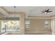 Bright dining room with tile floors, large windows, and a view of the pool at 8681 Crested Eagle Pl, Sanford, FL 32771
