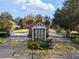 Gated community entrance with stone and wood accents at 8681 Crested Eagle Pl, Sanford, FL 32771