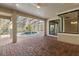 Screened pool and patio area with brick pavers at 8681 Crested Eagle Pl, Sanford, FL 32771