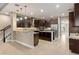 Gourmet kitchen with center island, stainless steel appliances and breakfast bar at 8681 Crested Eagle Pl, Sanford, FL 32771