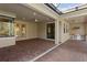 Covered patio with outdoor kitchen, built-in grill, and brick pavers at 8681 Crested Eagle Pl, Sanford, FL 32771