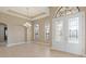 Bright dining room with tiled floors and a chandelier at 8681 Crested Eagle Pl, Sanford, FL 32771