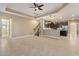 Large living room with tile floors, high ceilings, and a ceiling fan at 8681 Crested Eagle Pl, Sanford, FL 32771