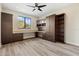 Home office with built-in desk, cabinets, and shelving at 8681 Crested Eagle Pl, Sanford, FL 32771