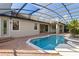 Enjoy this refreshing pool with a screened enclosure and brick pavers at 8681 Crested Eagle Pl, Sanford, FL 32771