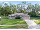 Charming house with a well-maintained lawn and driveway at 975 Brogden Dr, Clermont, FL 34711