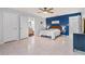 Bright bedroom with tile floors and ensuite bathroom at 975 Brogden Dr, Clermont, FL 34711