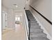 Elegant staircase leading to upper level of home at 10274 Hadley St, Orlando, FL 32829